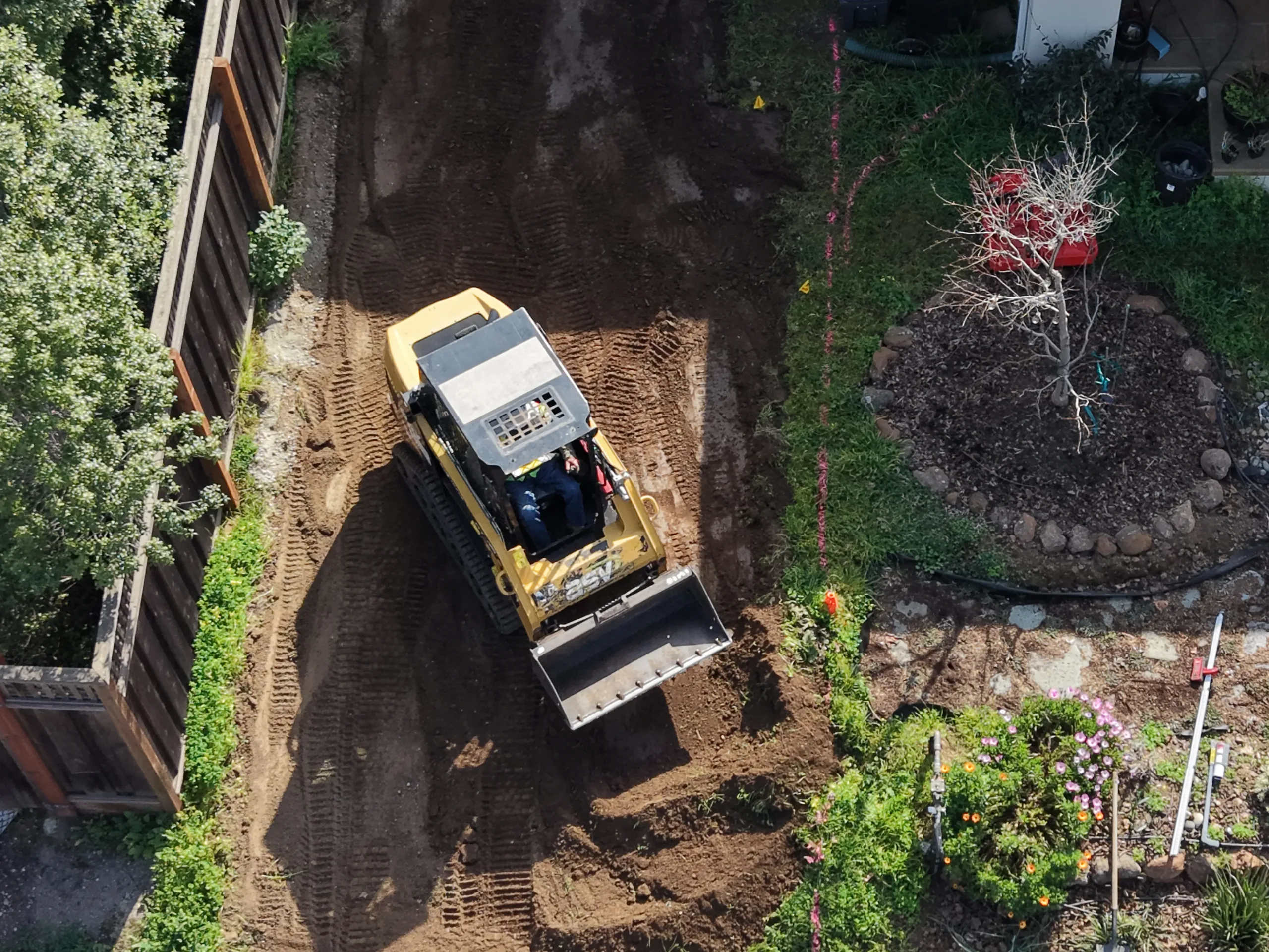 Overhead view of loader moving dirt